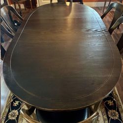 Dining room table plus leaves and protective mats