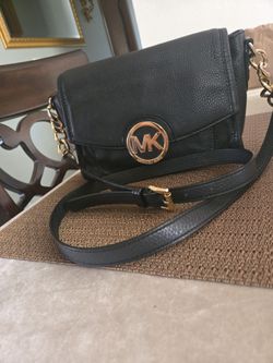 MK LEATHER , GREAT CONDITION    VERY CLEAN  , CROAST BODY  .