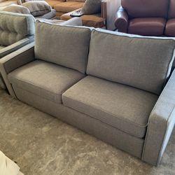 Grey Couch “WE DELIVER”