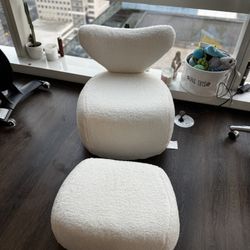 bouclé lounge chair with an ottoman 