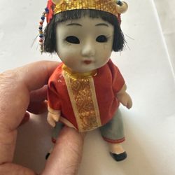 Vintage Japanese doll with bisque (unglazed) porcelain head  with sleep eyes that close when lying down