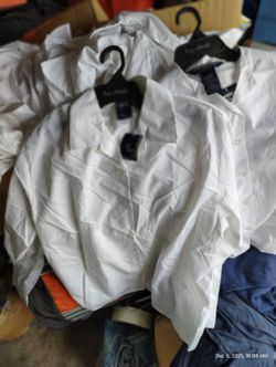 White dress shirts on hangers. 80 plus kid to teen shirts $50 for altogether. Located Mount Dora Fla 32757