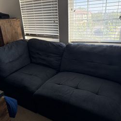4-piece modular sectional sofa in deep navy blue. 