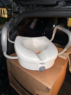 Raised toilet seat