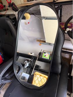 Black oval mirror