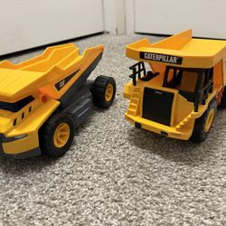 Yellow Cat Caterpillar Dump Truck One Left (on The Right)