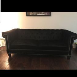 Black velvet sofa