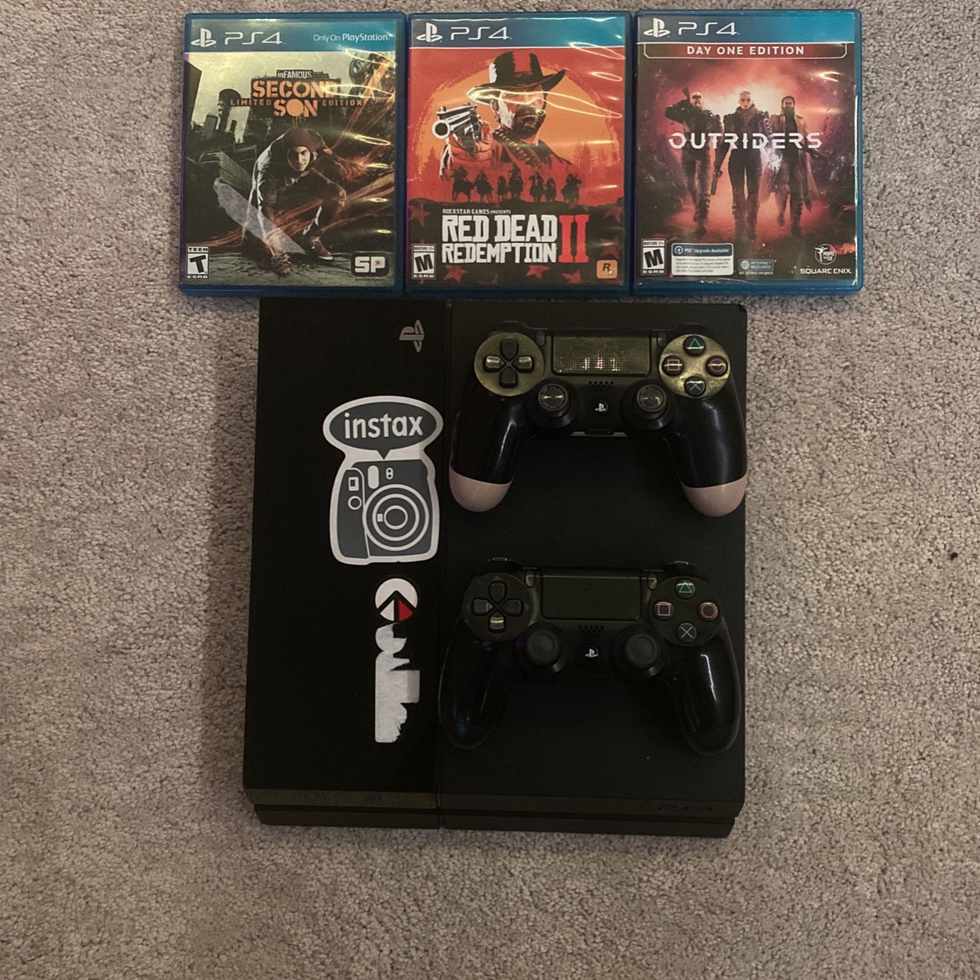 Playstation 4  (PS4) bundle with 3 games and two controllers and power cable (no HMDI)  Games: -Red Dead Redemption 2 -Outriders  -Infamous  