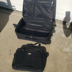 Suitcase On Wheels And With Duffle Bag 