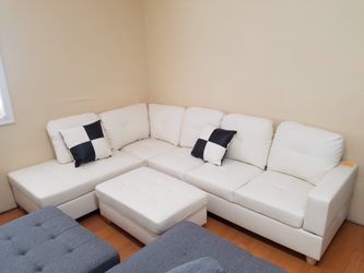 New in box white color faux leather sectional with pillows and ottoman