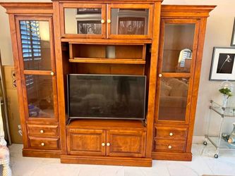 Beautiful Thomasville entertainment center with glass cabinets