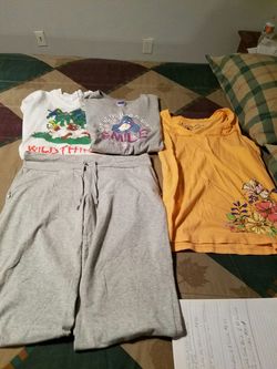 3 T shirts and a pair of capris. Barely worn. All of them