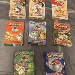 Assortment of Empty Pokémon Boxes and Manuals