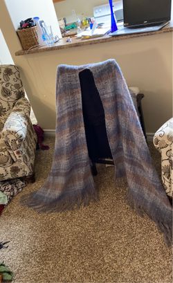 A Wrap That Is Beautiful ,It Has Blue Little Bit Of Orange, And A Hint Of Burgundy, But Mostly Blue.