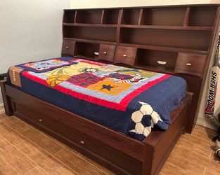 Canyon Twin Trundle Bed with matching desk and twin tower bookcases with storage.