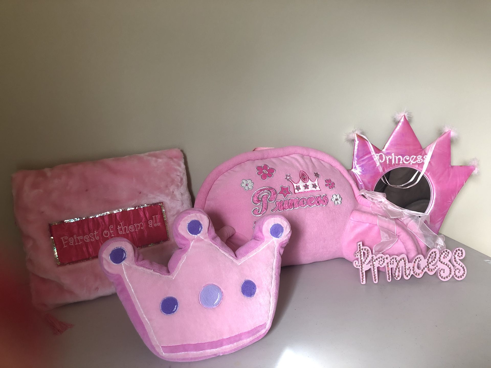 Pink princess decor: small bed backrest, mirror, two pillows and Princess wall sign