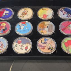 Peanuts coin collection with COA 12 coins