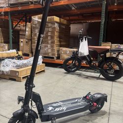 Front and rear shock-absorbing electric scooters