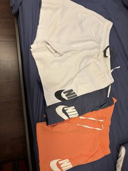 3 Nike shorts XL (orange/white) and L (blue)