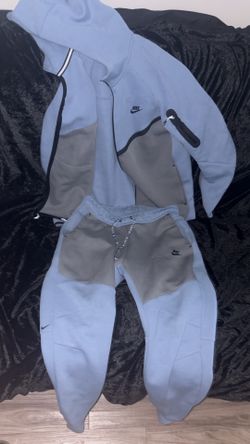 Sky blue and grey Nike tech suit