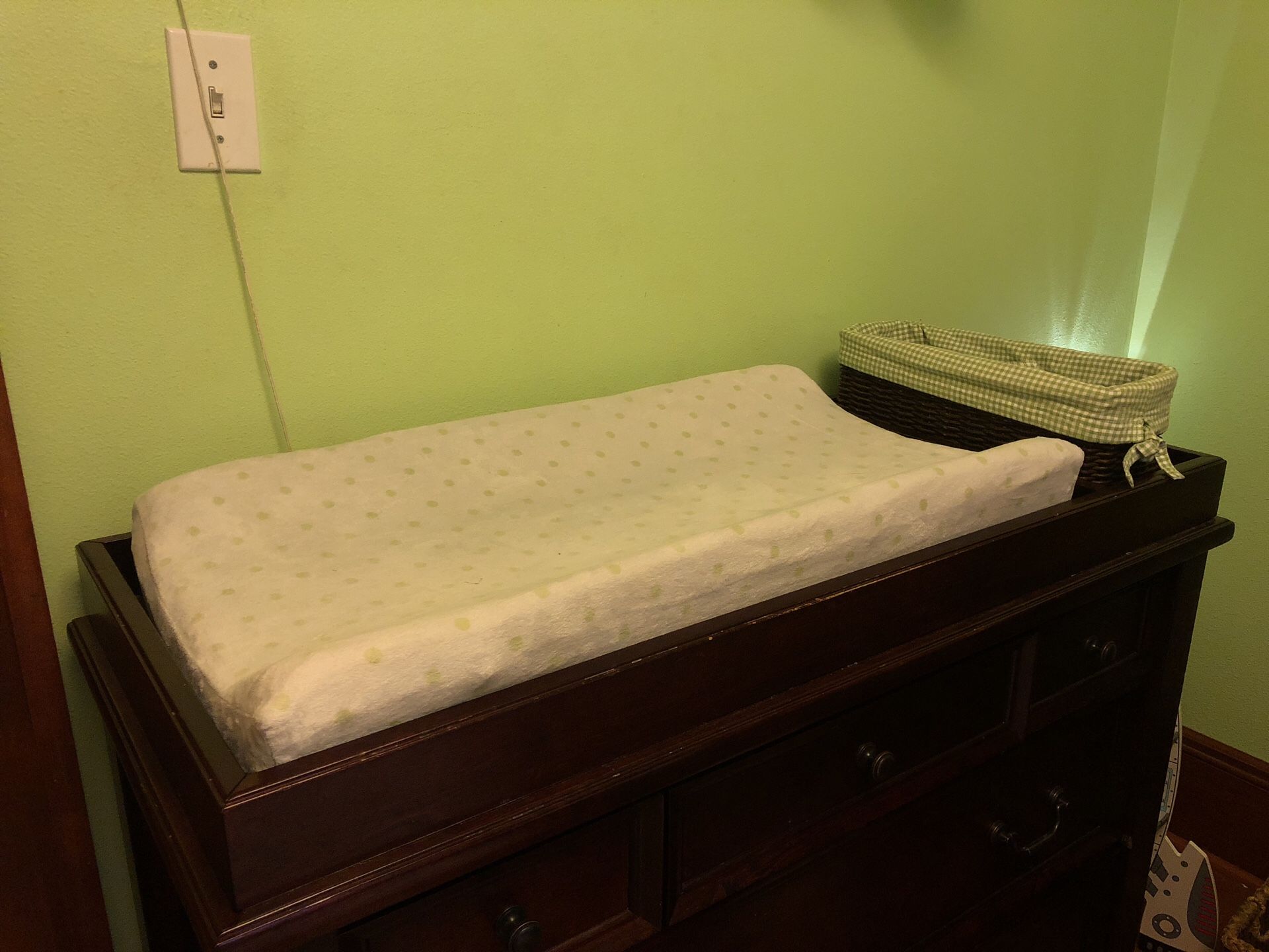 Pottery Barn kids changing table topper and diaper basket.