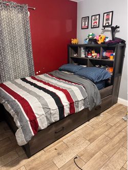 Full-size captain bed with twin size trundle bed