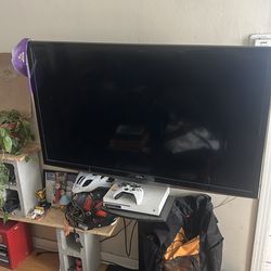 Toshiba tv w/ stand and Xbox 1s