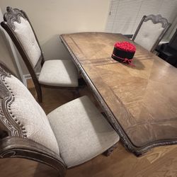 Carved Wood Pedestal Dining Table With 6 Upholstered Chairs