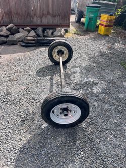 Trailer axle with wheels