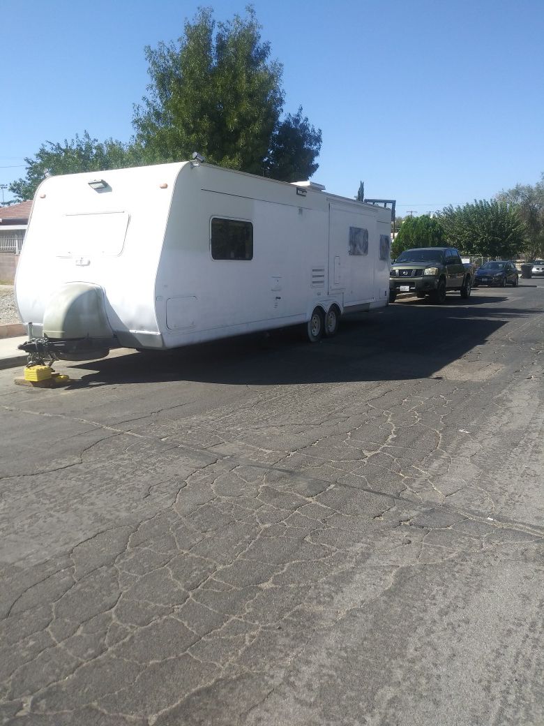 Limited time on price 31 ft Rv with pop out and have title