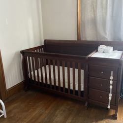 Crib And Mattress A Few Sheets With Changing Table Attached 