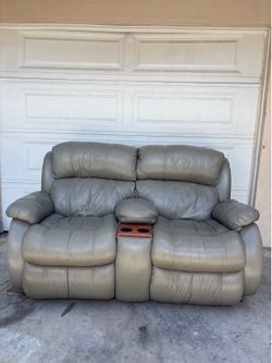 Leather reclining couch with center console