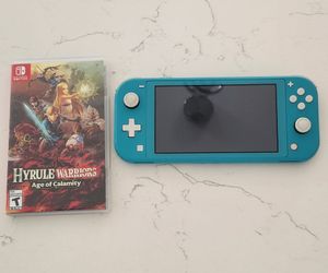 Nintendo switch lite plus a free game  hyrule warriors age of calamity