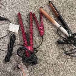 three flat irons,  straightener