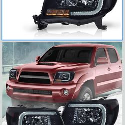 Pair of black housing headlights with Drl lights white  for Toyota Tacoma  2005 thru 2011