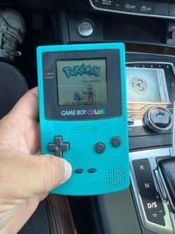 Gameboy Color turquoise with Pokemon blue
