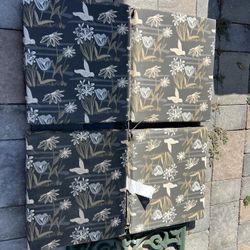 4 Piece Outdoor Patio Furniture Cushions in Floral Gray  Located in concord  Very good condition  No damages Covers not removable   Measures 18” x 17”