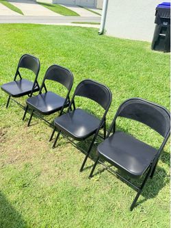 Selling 4 Black Folding Metal Chairs.
