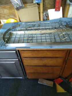 Stainless Steel Shelf With Wire Insert And Chrome Glass Holder You Put Underneath The Cabinet