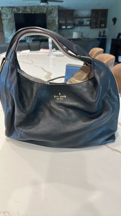 Leather Kate Spade hand bag to become a little bigger.