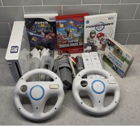 NINTENDO WII BUNDLE with 2 Remotes,2 Wheels, and Games