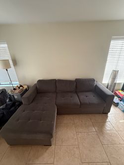 Gray Pull-Out Couch with Storage Compartment
