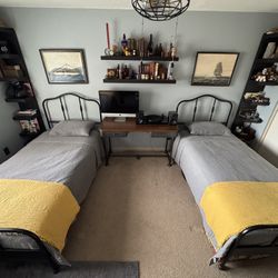 Matching sturdy like new IKEA Sagstua twin beds black w/ brass accents and Luroy mattress support slats