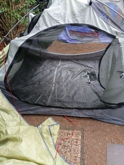 Black and gray screen tent two man with green cover