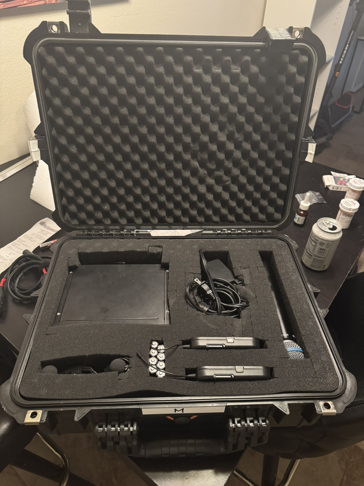 2 Shure BLX H10 wireless Receivers, 2 Handheld Beta 58 Mics, 2 Body Packs With Lava mics, and Case.