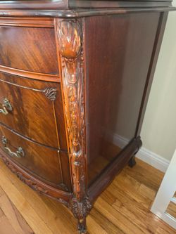 Antique 9 drawers dresser in brown.