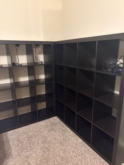 Two dark brown/black open cube book cases