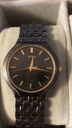 The watch in the image is a vintage Seiko V701-1K20 quartz dress watch