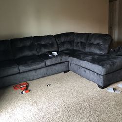 Charcoal Colored Sofa With A Pull Out Bed