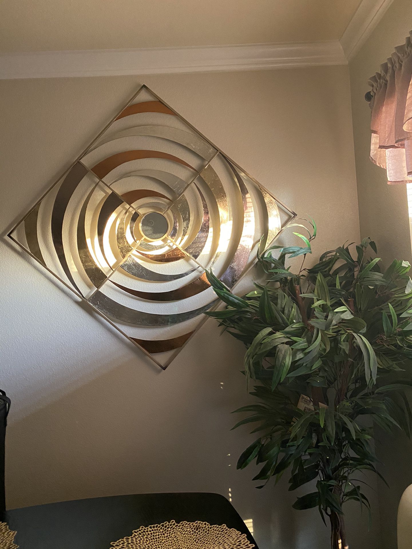 Swirl wall decor and brown twig